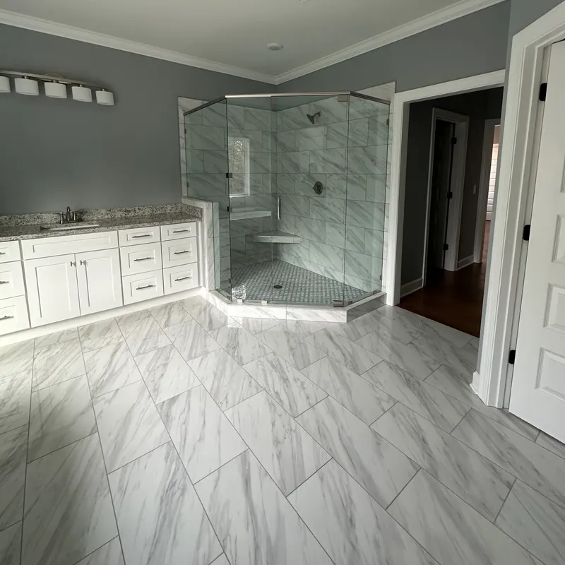 Master bath with marble floor and frameless shower, Atlanta GA