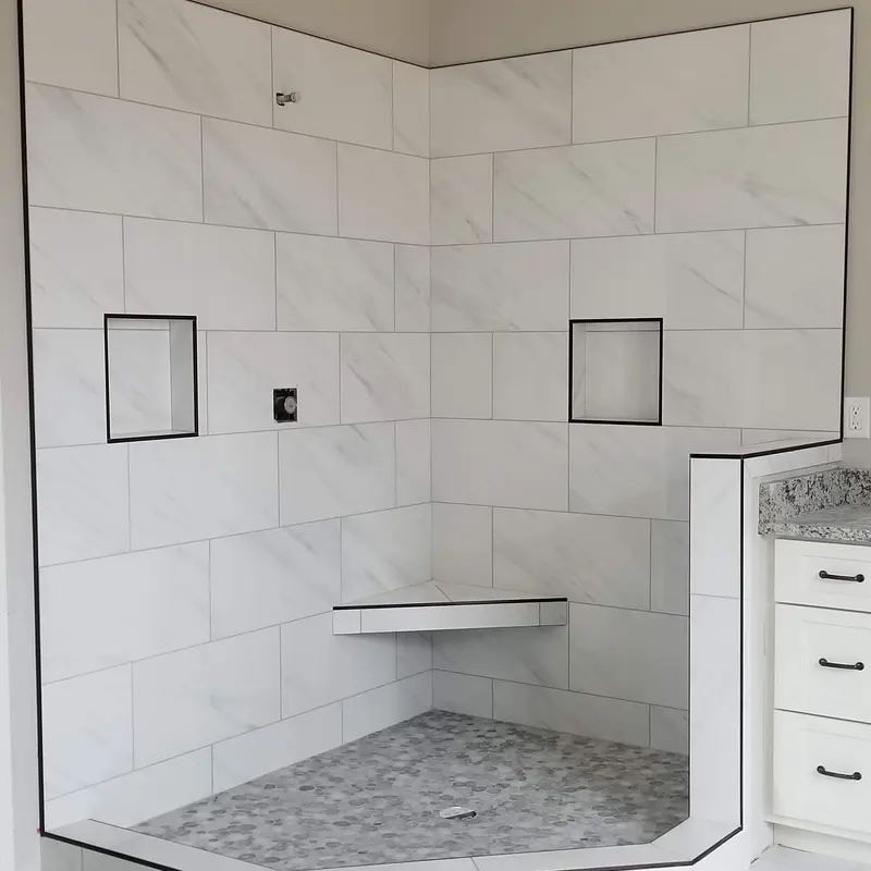 White marble shower with black pencil-liner trim, Atlanta GA