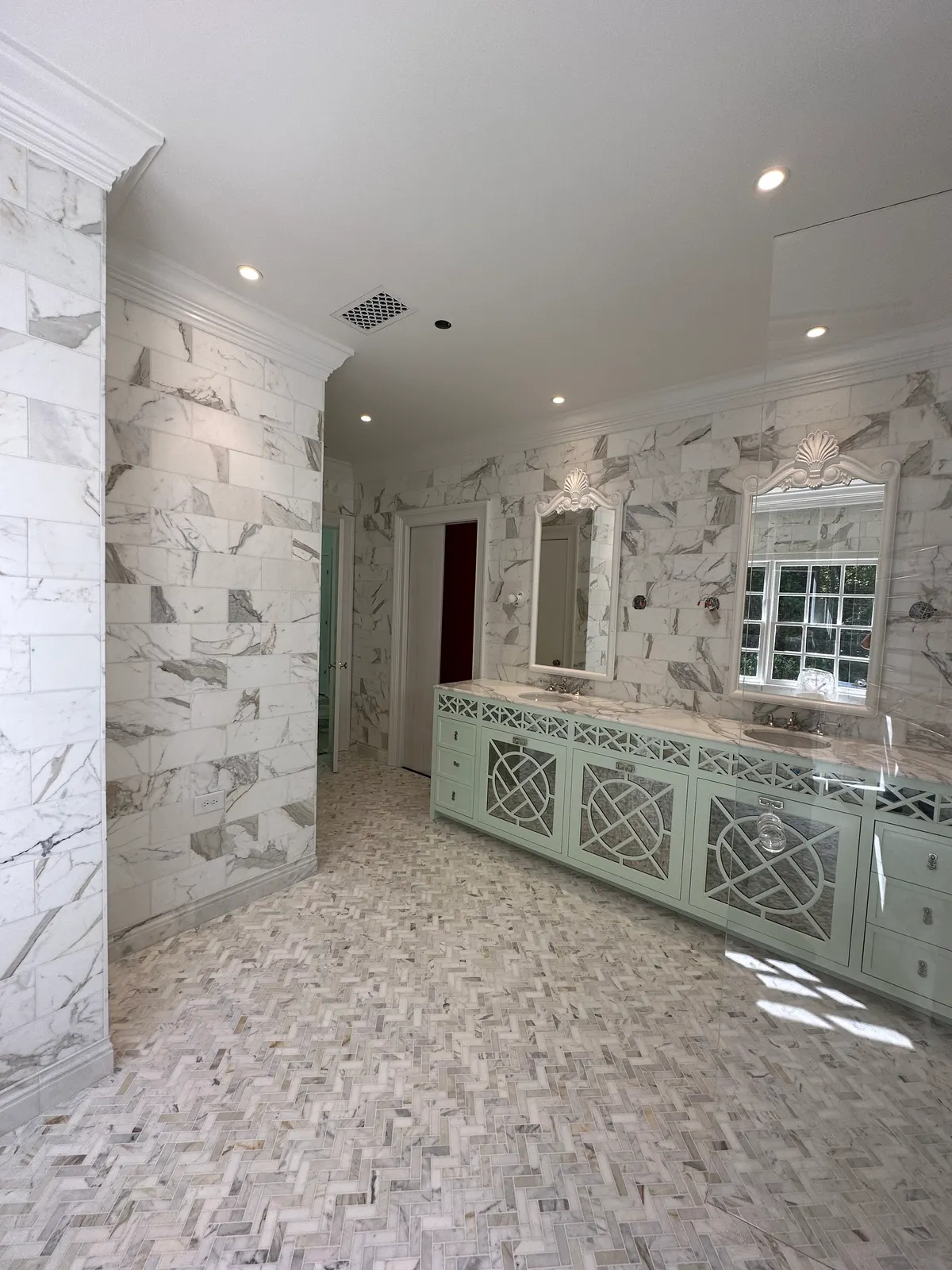 Full marble-look master bathroom with herringbone tile floor, Atlanta GA