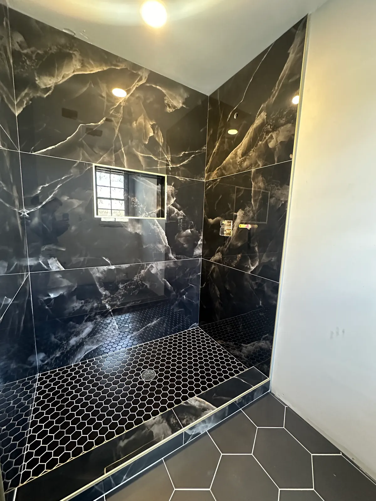 Black onyx-look porcelain shower with hex mosaic floor, Atlanta GA