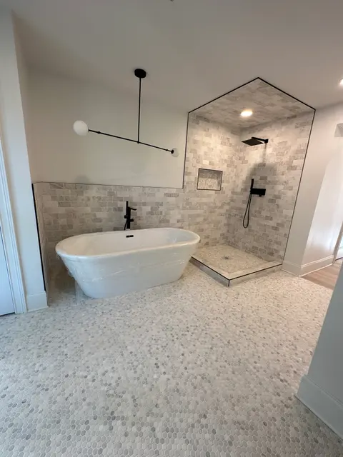Tub and marble subway shower with matte black fixtures, Atlanta GA
