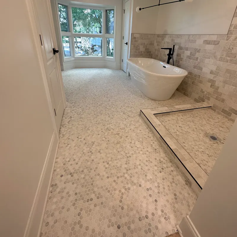 Marble mosaic floor with travertine border and tub, Atlanta GA