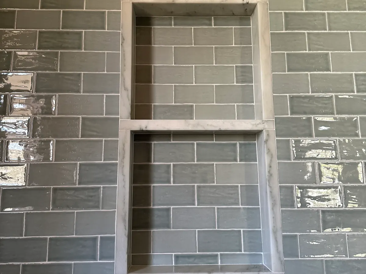 Handmade zellige niche with fine grout lines, detail work